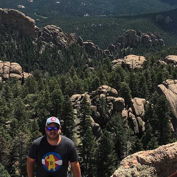 brian with back to mountains hiking