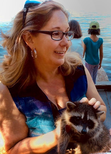 theresa holding a raccoon